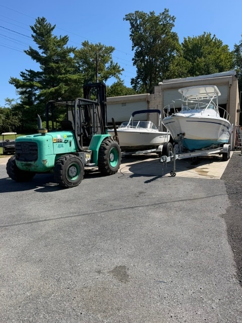 Marine technician performing boat engine service and repairs